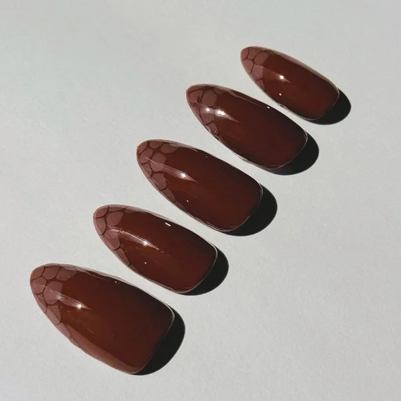 Glossy Brown Press-On Nails with snake skin French tips.